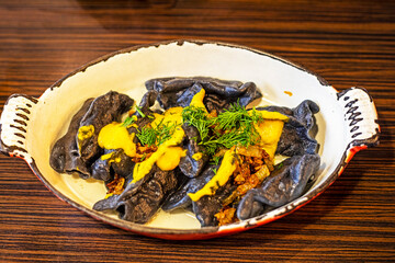 black dumplings with dietary meat. national cuisine of ukraine