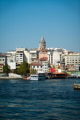 Fototapeta premium View of the Galata Tower integrated with the sea from the opposite shore of the Golden Horn.