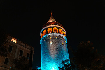 Naklejka premium View of Galata Tower illuminated with lights at night in Istanbul, Turkey.
