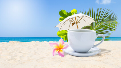 Coffee cup with flower and beach umbrella on tropical beach, relaxing by the beach, holiday and vacation destination