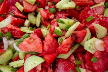 Close up of homemade Cucumber Tomato Salad. Vegetable salad with tomatoes, cucumbers and onion