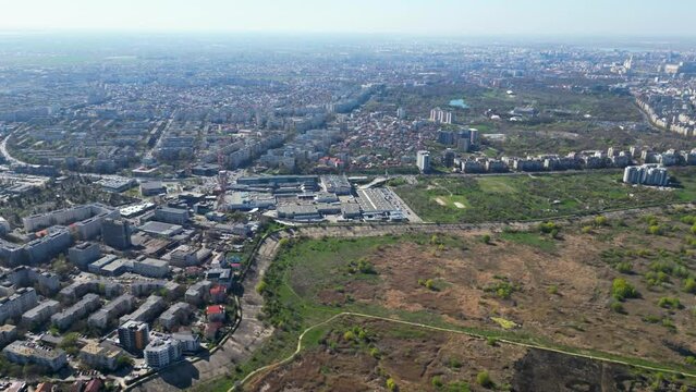 High angle drone shot of Vacaresti Nature Park in Bucharest. Natural reserve in the middle of the capital city of Romania. Swamp, bird's nests and paths for hiking and nature exploration.
