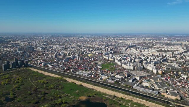 High angle drone shot of Vacaresti Nature Park in Bucharest. Natural reserve in the middle of the capital city of Romania. Swamp, bird's nests and paths for hiking and nature exploration.
