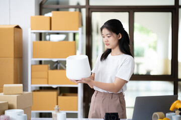 Entrepreneur Conducting Product Quality Check in Workspace