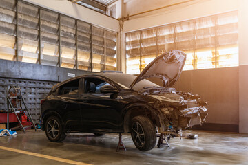 car repair in garage service station with soft-focus and over light in the background