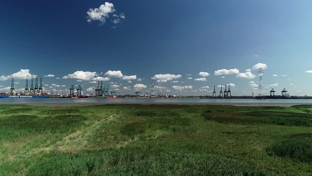 Drone footage of the Port of Antwerp as seen from a natural reserve in Doel village, Belgium