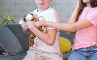 Close-up of children brother and sister who fighting for a toy. Conflict, fight of anger between...