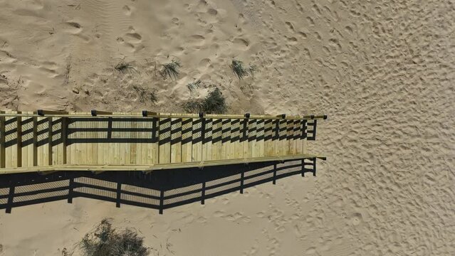 Direct aerial of a staircase attached to the boardwalk.