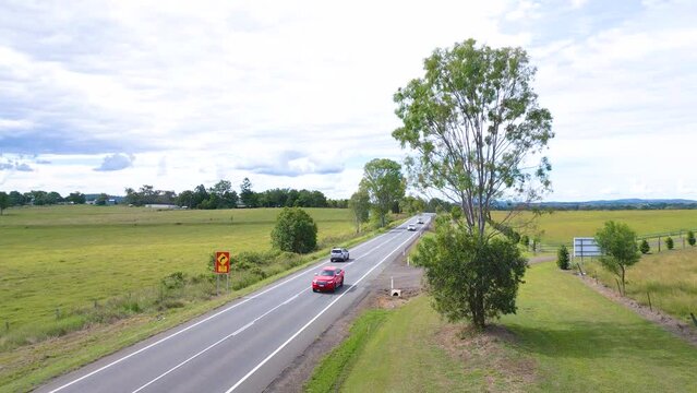 Cars driving on the Cunningham Highway north of Aratula in Queensland Scenic Rim region in Australia.