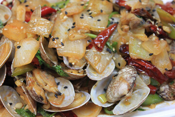stir-fried clams on a plate