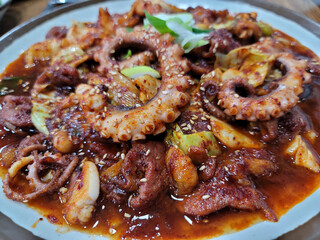 stir-fried spicy seafood on a plate