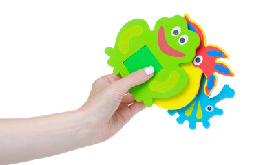 Baby bath toys in hand on white background isolation