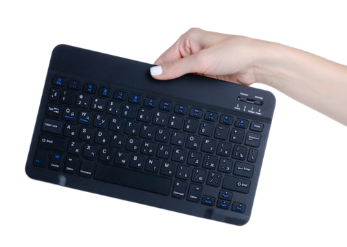 Black mini PC keyboard in hand on white background isolation
