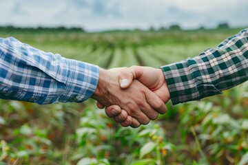 A farmer and a supermarket manager shaking hands in a field, representing direct farmtostore relationships