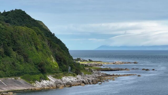 Garron Point on The Antrim Coast Road in Northern Ireland. Part of the Causeway Coastal Route. Aerial 50fps UHD