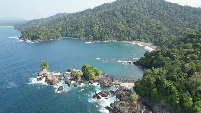 Picturesque bay with white sand beach and lush jungle backdrop in the Utr&iacute;a National Park near Bah&iacute;a Solano in the Choc&oacute; department on the Pacific Coast of Colombia