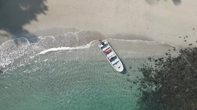 Small boat in turquoise water at a secluded beach in the Utr&iacute;a National Park between Bah&iacute;a Solano and Nuqu&iacute; in the Choc&oacute; department on the Pacific Coast of Colombia