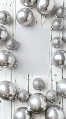 Silver balloons and empty white card on wooden background