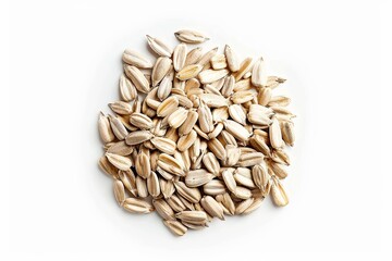 Obraz premium Shelled sunflower seeds on white background top view