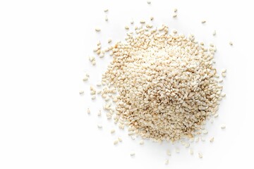 White sesame seeds viewed from above against white background