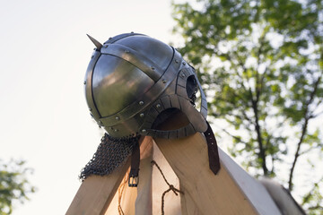 Naklejka premium Viking helmet at tent camp at the historic festival