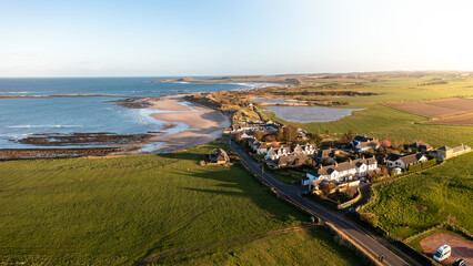 Aerial view of Low Newton By The Sea on the Northumberland coast at sunset