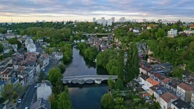 Pont Joubert bridge on Clain river at Poitiers, France. Aerial forward at sunset