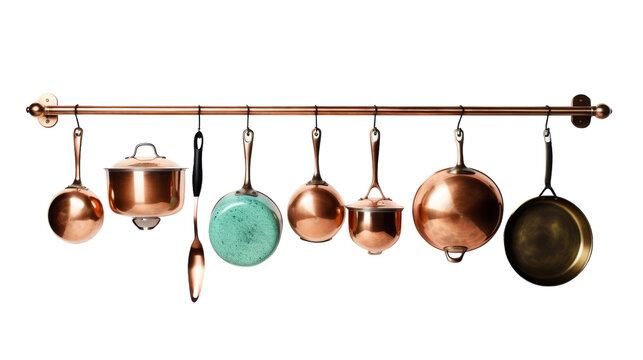 Pots and pans hang elegantly from a rustic rack in a kitchen setting