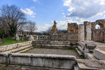 Fototapeta na wymiar Stroll through the historic remains of Hadrian's Bath, where the ancient stone structures and serene statues of Afrodisias whisper tales of the past under the watchful eye of the Turkish sky.
