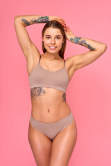 Cosmetology, beauty and spa treatment. Woman in lingerie on pink background.