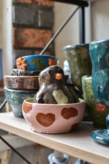 ceramic figurine of a penguin sitting in a cup