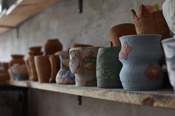 atmospheric shelf with different clay pots