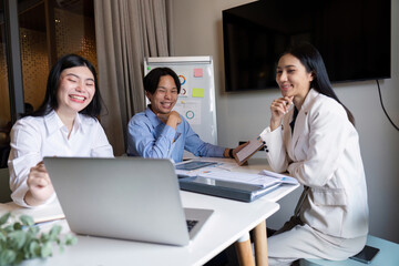 Business team meeting talking planning analyzing investment and marketing on tablet and laptop, discussing with financial data and business strategy, presentation to making profit of company