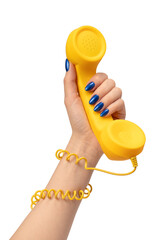 Yellow handset in woman hand isolated on white. Copy space. - obrazy, fototapety, plakaty