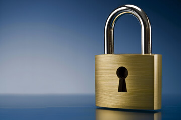 Fototapeta premium Shiny metal padlock on a reflective surface with a blue background.