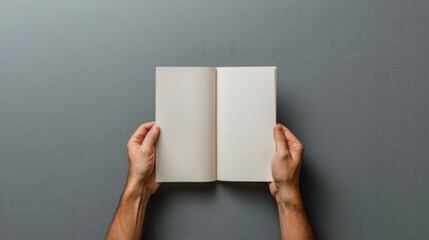Hands of person holding blank white empty paper mock up. Man or woman presenting mockup paper page...