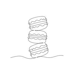 Continuous one line drawing of colorful French macaroons isolated on white background