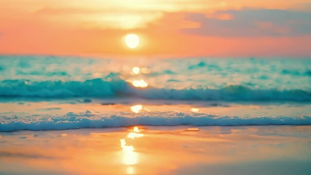 Defocused beach sunset As the sun dips below the horizon the colors of the sky and ocean meld together in a dreamy blurred haze setting the scene for a romantic evening. .