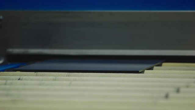 The glass goes into the machine on rollers and goes through the tempering process