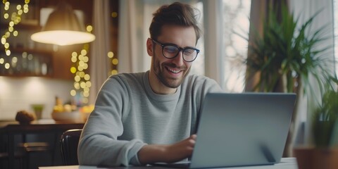 Modern Work Environment: Cheerful Guy Engaged in Online Tasks