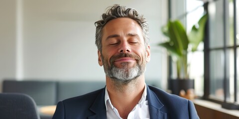 Successful Middle-Aged Businessman Finding Serenity in Office