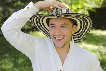 Handsome Hispanic man wearing a hat 
