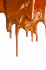 Dripping caramel sauce texture on a white background