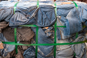 Brussels, Belgium, Europe. Bale of used jeans ready to be resold by the kilo to upcycle pre used garments. 