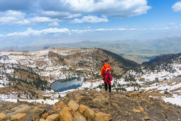 Hiking men enjoy the landscape  Albania Valamara lake in mountain 