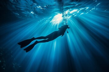 Submerged Diver Surrounded by Brilliant Blue Ocean Waters and Sun Rays - Adventure Tourism, Diving Excursions, Oceanic Studies