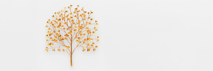 Golden artificial tree on white background