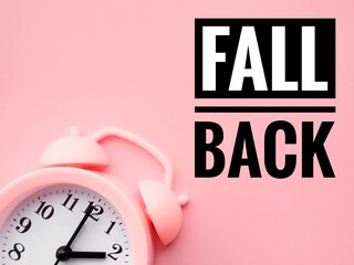 Alarm clock at 2 o'clock changing to Winter Time. Fall back or time change concept