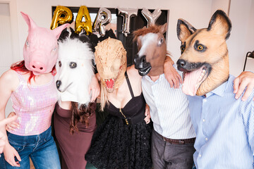 Theme party with animal masks. Friends having fun at a different party. Concept: laughter