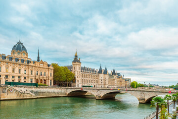 Conciergerie palace and Tribunal de Commerce de Paris with Pont au Change over Seine river in...